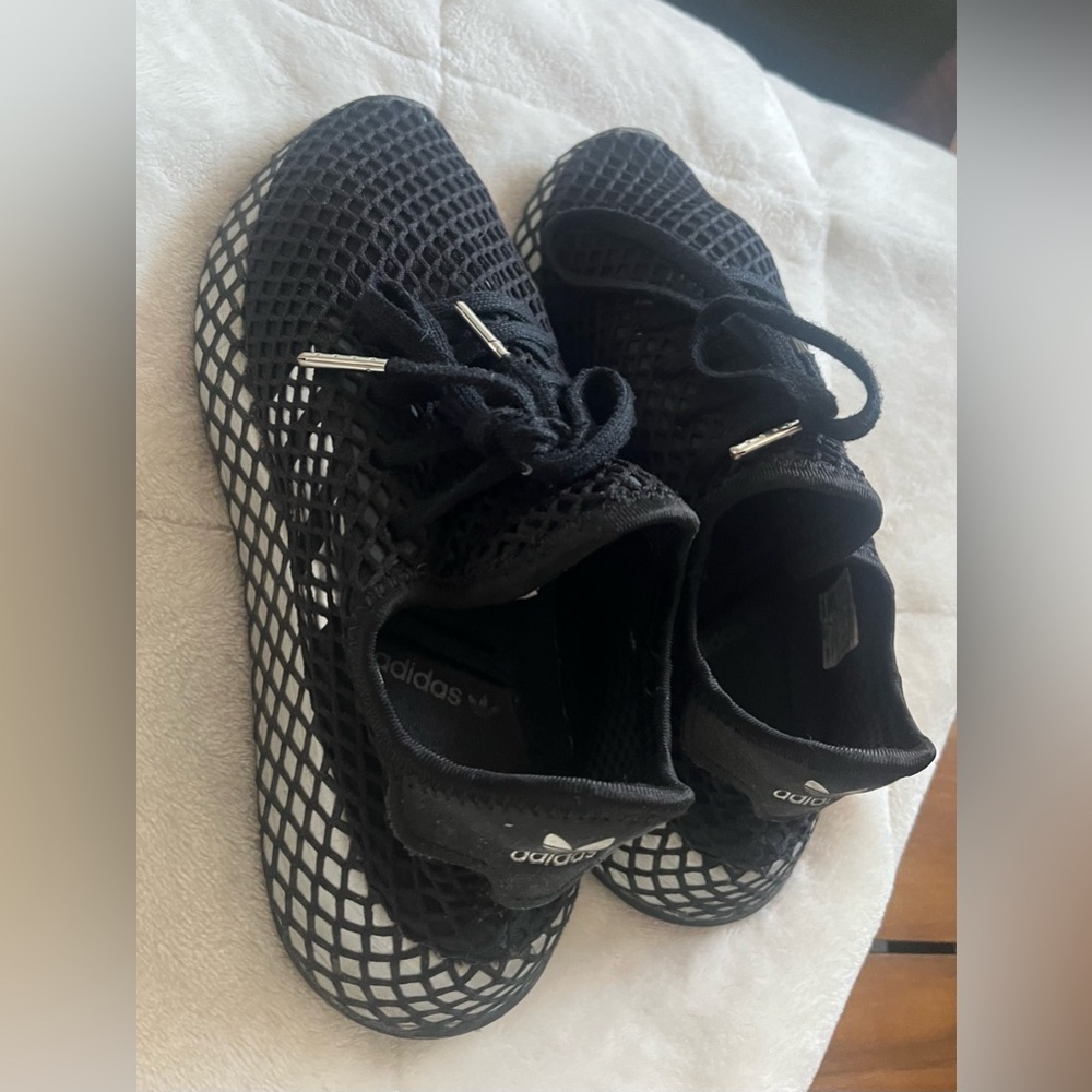 Black with silver adidas shoes-runs big ,enought to cover to size 6